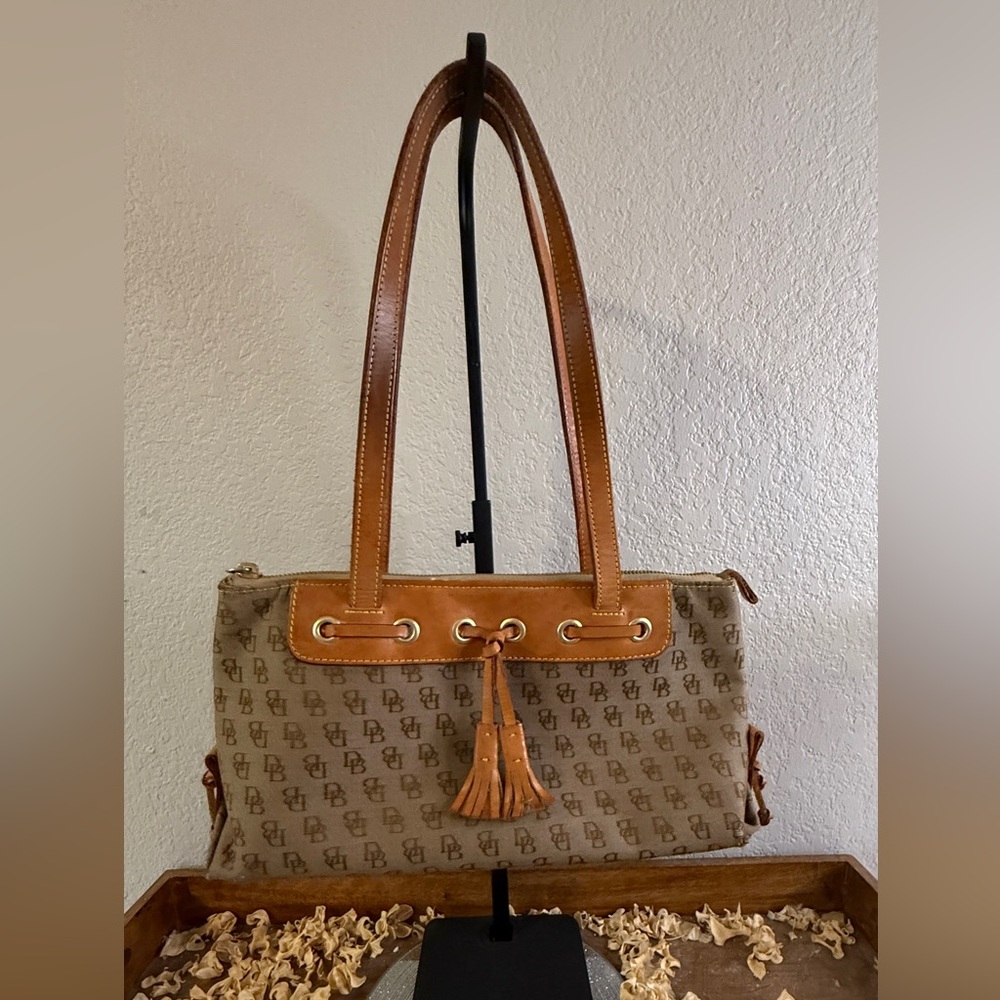 Dooney & Burke Tassel Accent Logo-Print Shoulder Bag in Tan